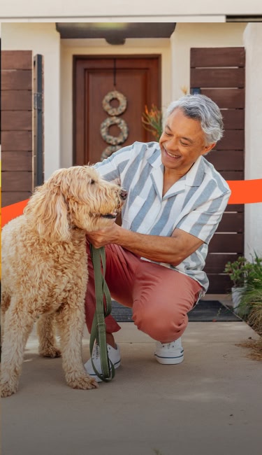 happy man taking his dog for a walk